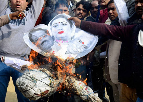 Protestors burn an effigy of HRD Minister Smriti Irani, Union Labour Minister Bandaru Dattatreya and Hyderabad Central University Vice Chancellor Appa Rao during a protest against the suicide of Dalit student Rohith Vemula, in Allahabad on Friday. PTI Photo