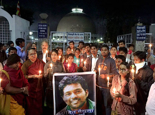 Buddhist monks and students during a candle light march seeking justice for Rohit Vemula, who committed suicide at Hyderabad Central University, at Dikshabhoomi in Nagpur. PTI Photo