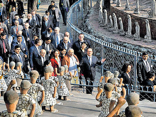 French President Francois Hollande and Prime Minister Narendra Modi take a stroll of the Rock Garden on Sunday. PTI