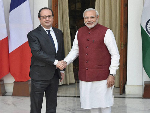 Prime Minister Narendra Modi with French President Francois Hollande before their meeting at Hyderabad House in New Delhi on Monday. PTI Photo