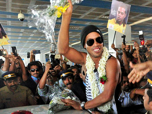 Braizilian Football legend Ronaldinho being welcomed by his suppoters upon arrival at Kozhikode international airport on Sunday. PTI Photo