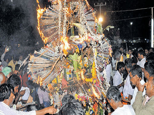 The Chandramandalotsava ritual being observed during  Siddappaji jatra, at Chikkallur, Kollegal taluk, on Sunday night. The Chandramandala decorated with flowers, hombale (coconut inflorescence), banana stalks, and buntings was  set afire at 11 pm on Sunday, with hundreds of devotees  witnessing the annual event. DH photo