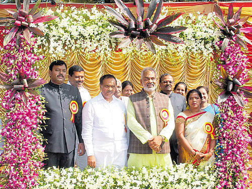 District In-charge Minister A Manju, MLA&#8200;H S Prakash and others pose behind a photo frame made of flowers, at the Horticulture show, organised as part of Republic Day celebrations at Silver Jubilee Park, in Hassan, on Tuesday. DH photo