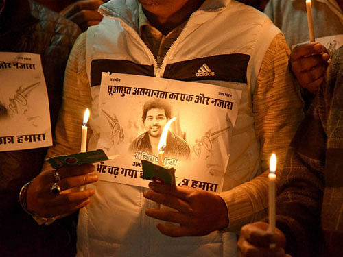 Activists holding a photo of Rohit Vemula who committed suicide at Hyderabad Central University during a candle light march in Bikaner on Thursday. PTI file Photo