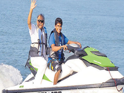 Minister for Youth Empowerment and Sports K Abhayachandra Jain enjoys a jet ski ride at Mantra Surf Club at Kolachikambala near Mulki. DH photo