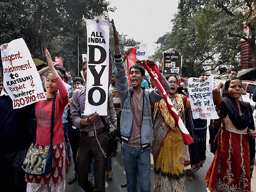 Activists of SUCI student and Youth wings shouting slogans outside a city court in Kolkata on Thursday demanding punishment of those accused who are involve in Kamduni Gangrape and murder case. PTI Photo.