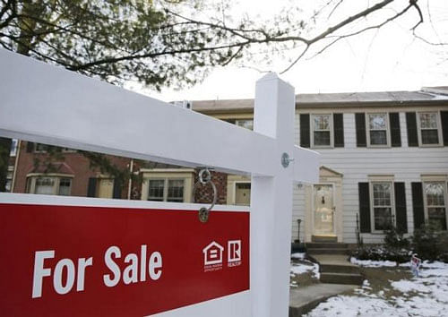 A home for sale sign hangs in front of a house in Oakton, on the day the National Association of Realtors issues its Pending Home Sales for February report, in Virginia March 27, 2014. Reuters