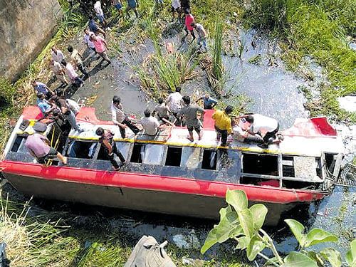 The KSRTC bus which fell into the Shimsha river in Maddur, Mandya district on Thursday. Rescue operations are underway. KPN
