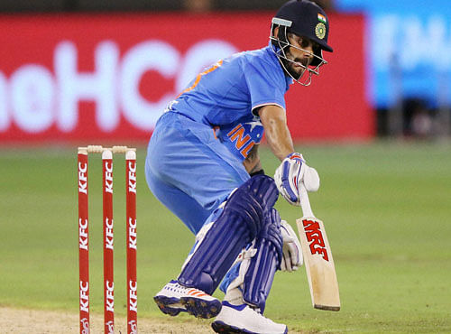 India's Virat Kohli makes a run during their T20 Match against Australia in Melbourne. PTI photo