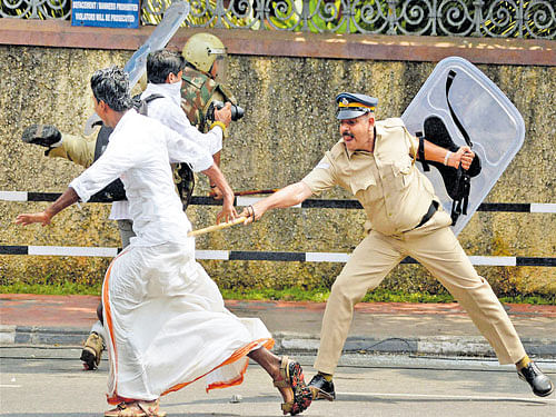 Police resort to baton charge to thwart a protest by DYFI members in Thiruvananthapuram on Friday. PTI