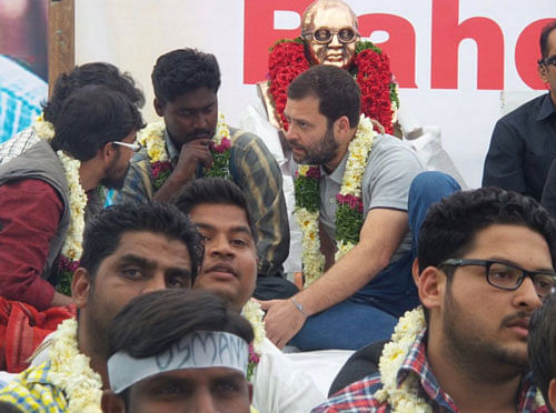 Rahul Gandhi sits on fast with the agitating students at the University of Hyderabad on Saturday. Photo Credit: INC/Twitter