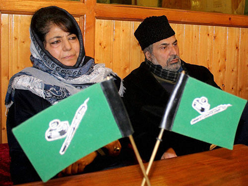 Peoples Democratic Party (PDP) President Mehbooba Mufti along with Party Senior Vice-President and Member Parliment Muzaffar Hussain Beigh during a crucial party meeting on Goverment formation following the death of her father and Chief Minister Mufti Mohammad Syed,at Mufti Residence in Srinagar on Sunday. PTI Photo