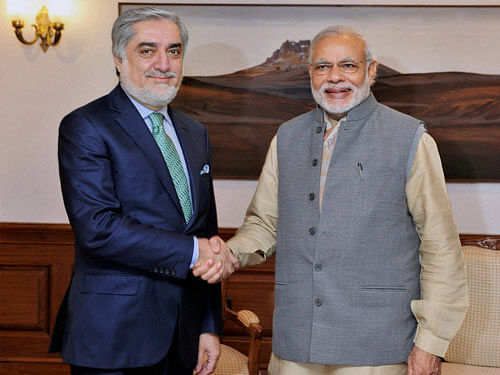 Prime Minister Narendra Modi shakes hands with the CEO of Afghanistan Abdullah Abdullah in a meeting in New Delhi on Monday. PTI Photo