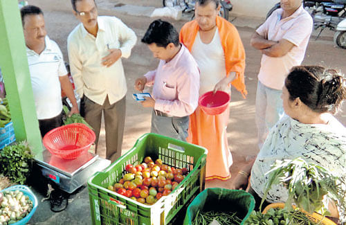 Santhosh and Abhijit sell vegetables in Gokak town twice a week.