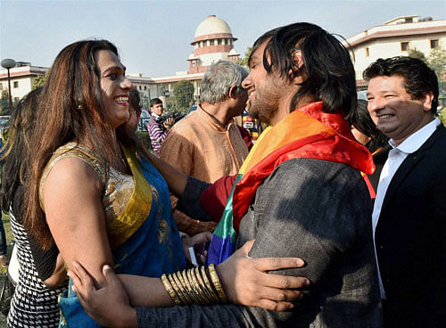 Gay rights supporters celebrate outside the Supreme Court in New Delhi on Tuesday after the apex court agreed to hear the petition on Section 377 which makes gay sex a criminal offence. PTI Photo