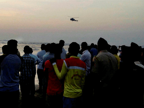 A Coast Guard helicopter helping in rescue works at Murud Janjira beach near Alibaug in Raigad district on Monday. Thirteen students, including three girls, from a Pune college were feared drowned at beach. PTI file photo