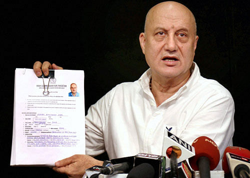 Bollywood actor Anupam Kher, who was denied a visa by Pakistan to attend a literary festival in Karachi, addresses a press conference in Mumbai on Tuesday. PTI Photo