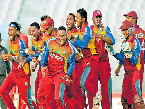 Jubilant West Indies' players celebrate after posting a thrilling victory over Zimbabwe at Chittagong on Tuesday. ICC Media