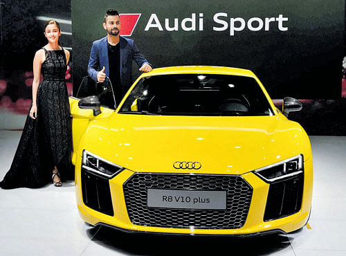 FAST BECOMES FASTER: Actor Alia Bhatt and Test captain Virat Kohli at the launch of Audi's newsports car R8 V10 plus at the Auto Expo 2016 in Greater Noida on Wednesday. The auto show began with the country's largest car maker Maruti Suzuki India unveiling the new compact sports utility vehicles, 'Vitara Brezza' PTI