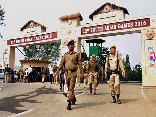 Security personnel keep a tight vigil at the main entrance to Indira Gandhi Athletics Stadium in Guwahati on Thursday, a day before the opening of12th South Asian Games at the stadium. PTI Photo.