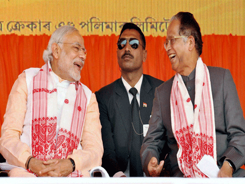 Prime Minister Narendra Modi and Assam Chief Minister Tarun Gogoi at the inauguration of a petrochemical complex of Brahmaputra Cracker and Polymer Ltd in Dibrugarh on Friday. PTI Photo.
