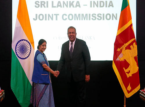 Indian External Affairs Minister Swaraj shakes hands with Sri Lanka's Foreign Minister Samaraweera during the Sri Lanka-India Joint Commission meeting in Colombo. Reuters photo