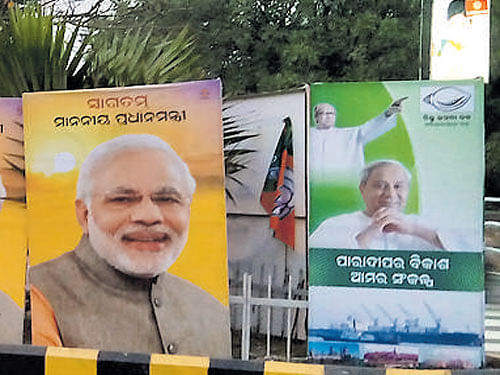 A poster war is on between the BJP and the BJD in Bhubaneswar on the eve of the prime minister's arrival. DH Photo