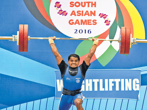 IMPRESSIVE India's Gururaja in action in the 56 kg category weightlifting competition on Saturday. PTI