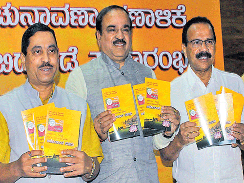 BJP State president Pralhad Joshi  releases the party manifesto for the zilla and taluk panchayat elections at the BJP office in Bengaluru on Saturday.  Union Ministers Ananth Kumar, D V Sadananda Gowda are seen. KPN