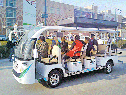 The driverless shuttle ferries visitors between pavilions, at the Auto Expo in Greater Noida, on Sunday.