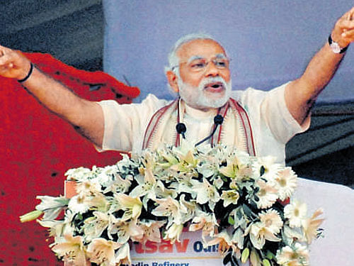 Prime Minister Narendra Modi addresses a gathering at the inauguration of IOC's oil refinery, in Paradip on Sunday. PTI