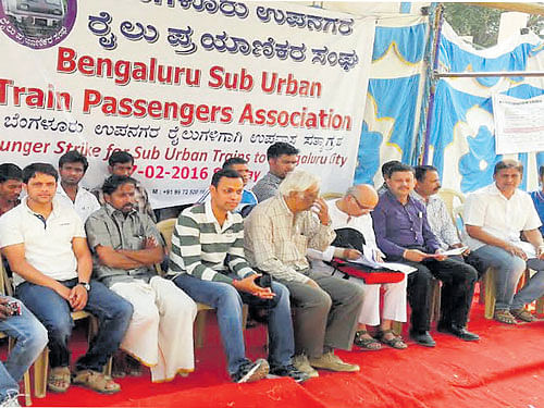meet our demands: Members of the Bengaluru Suburban Train Passengers' Association on a hunger strike in the City on Sunday. dh Photo