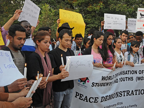 Various colleges foreign students are participated under the banner of World Organisation of Students and Youth (WOSY) a silent candle light condolence on the death of Sabana Taj and protest demanding safety, security for foreign students, Help Centres, Grievance cell and take action on attack on Tanzanian girl at Freedom Park in Bengaluru. DH Photo
