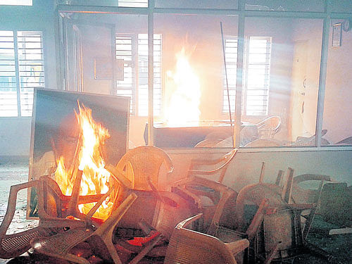 Agroup of JD(S)workers set fire to the furniture and a portrait of JD(S) supremoHDDeve Gowda and State presidentHDKumaraswamyat the party office inHD Kote,Mysuru district, on Tuesday. DH PHOTO