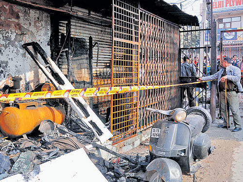 A shop-cum-residence which caught fire at Dilshad Garden in East Delhi on Tuesday. DH Photo