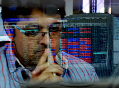 An investor watches stock price at the Bombay Stock Exchange (BSE) as the sensex declines by nearly 300 points in Mumbai on Tuesday. PTI Photo