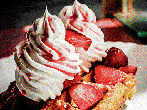exotic Liege waffle with strawberries and whipped cream. (Below) Waffles with Nutella and banana.