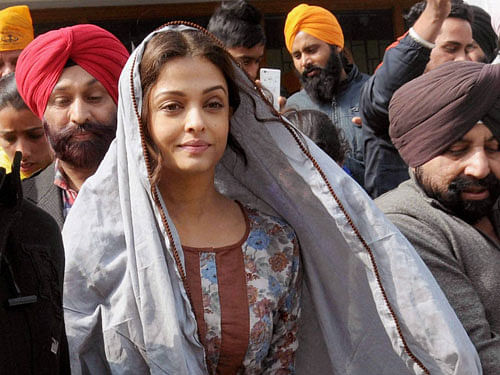 Bollywood actress Aishwarya Rai Bachchan gestures during a visit to the Golden temple in Amritsar on Friday. Aishwarya visited the city during filming for her new film 'Sarbjit'.PTI Photo
