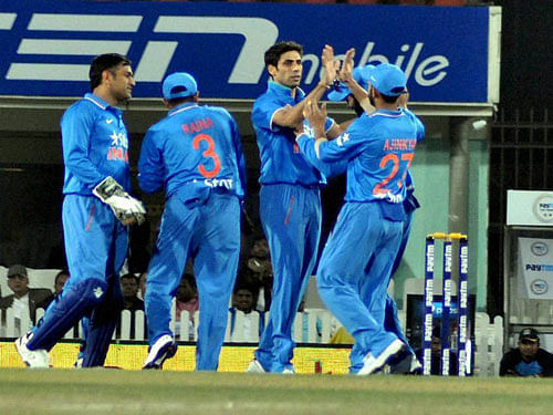 Indian cricketers celebrate the fall of a Sri Lankan wicket during the second T20 match in Ranchi on Friday.PTI Photo