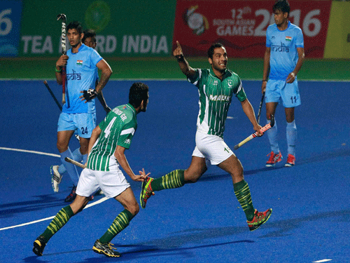 Pakistan's Awais Ur Rehman, second right, celebrates after scoring a goal against India during the final match of hockey at the South Asian Games in Guwahati on Friday. PTI Photo