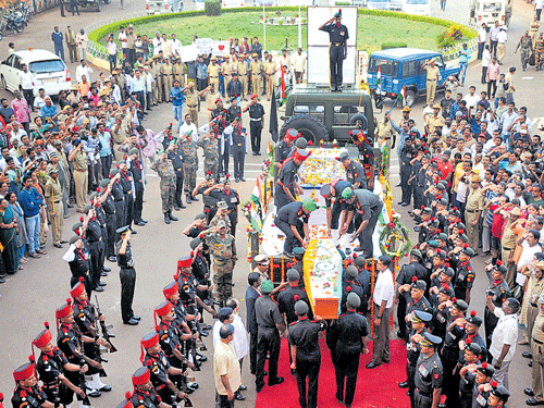 Bidding farewell: Armymen pay their last respects to Lance Naik Hanamanthappa Koppad in Hubballi on Friday. His grieving family members at his funeral at his native village of Betadur near Hubballi. (Below, from right) Havaldar Ramesh G and Lance Naik Raju Siruguppe, who flew down from Siachen with the mortal remains of their comrade Koppad. DH photo