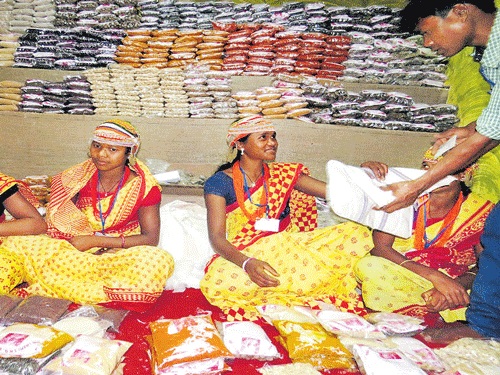 Tribal women with their products at a stall in Advasi Mela or tribal fair, an annual event, recently held in Bhubaneswar.