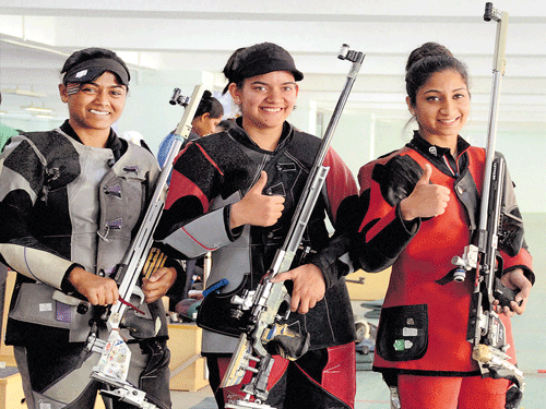 girls, guns and gold!: India's Anjum Moudgil (middle), Elizabeth Koshy (right) and Lajja Gauswami after the women's 50M rifle final at the 12th&#8200;South Asian Games in Guwahati on Saturday. pti