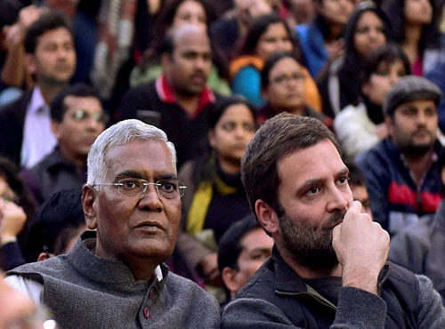 Congress vice president Rahul Gandhi and CPI MP D. Raja sit with students of the Jawaharlal Nehru University (JNU) in New Delhi on Saturday. Gandhi,, Raja went to the campus to meet the students protesting for the release of Student Union president Kanhaiya Kumar. PTI Photo