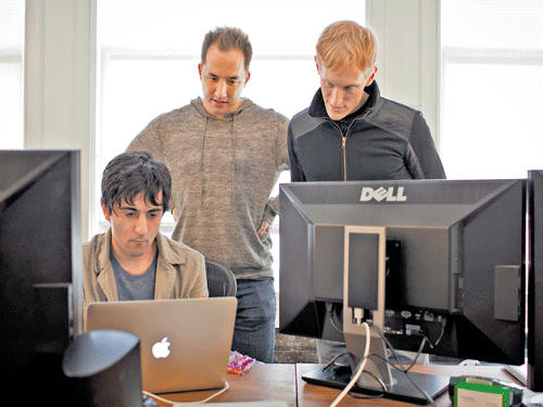 A file photo of Arash Ferdowsi, co-founder of Dropbox, Drew Houston, chief executive, and Jeff Bartelma, director of products, at the company's office in San Francisco. INYT