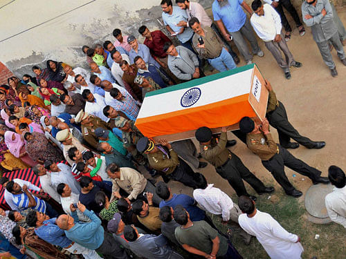 The mortal remains of Sepoy Mahesh and Subedar Nagesh were laid to rest at their native villages Pashupati in Mysuru district and Tejuru in Hassan district respectively. pti file photo for representation