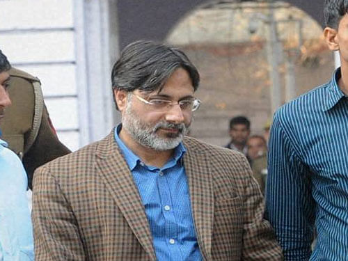 Former Delhi University professor SAR Geelani being taken to Patiala House Courts from Parliament Street Police Station in New Delhi on Tuesday. Geelani has been arrested on sedition and other charges for allegedly organising an event in support of Parliament attack convict Afzal Guru. PTI Photo