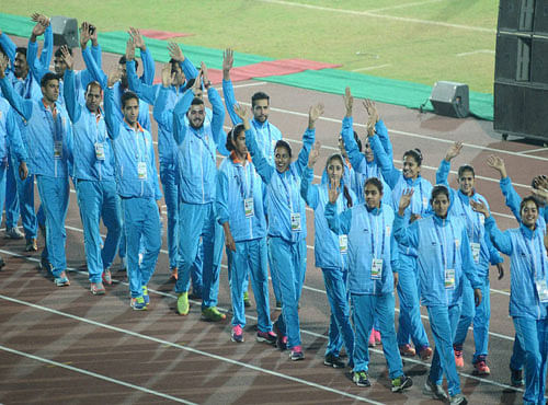Indian athletes acknowledge the crowd. PTI