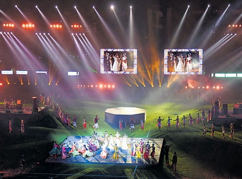DIFFERENT STROKES: Artists perform at the closing ceremony of the 12th South Asian Games in Guwahati on Tuesday. PTI photo