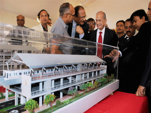 Metro man E Sreedharan with Metro Rail Managing Director Brajesh Dixit (2nd L) and others looks on model of a Metro station during the 1st Foundation Day of 'Majhi Metro' organised by Nagpur Metro Rail Corporation Ltd, in Nagpur on Thursday. PTI Photo.